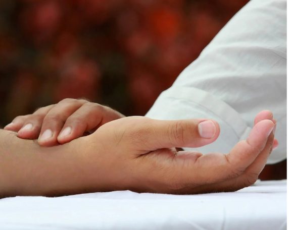 Ayurvedic doctor performing Nadi Parikshan pulse diagnosis